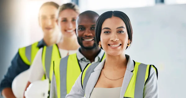 Diversity, team and portrait of engineering employees standing in an industrial office. Industry workers working on a site development project together in a corporate room at the staff warehouse