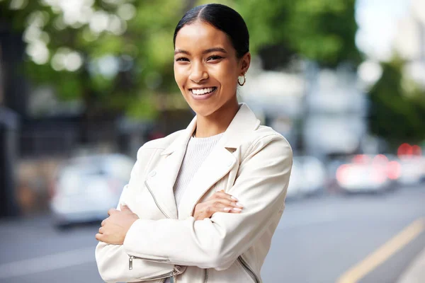 Business woman working for corporate company in the city, smile for management and happy with leadership at work. Portrait of a professional African employee, worker or manager with arms crossed.