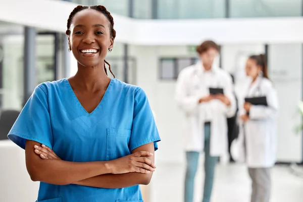 Nurse, healthcare and medicine with a woman working in healthcare for health, wellness or insurance in a hospital. Portrait of a female medical student or professional standing arms crossed inside.