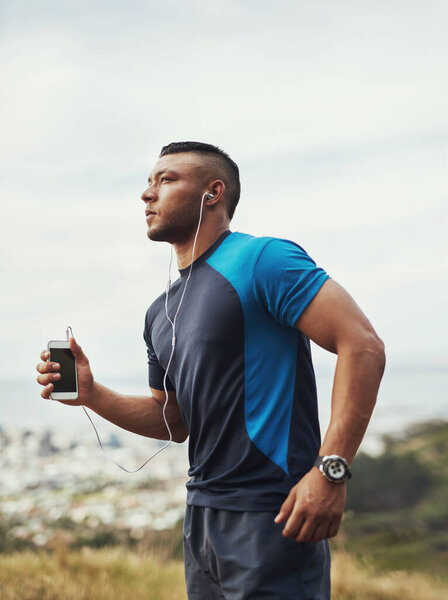 Dont stop when youre tired...stop when youre done. a young man running outdoors