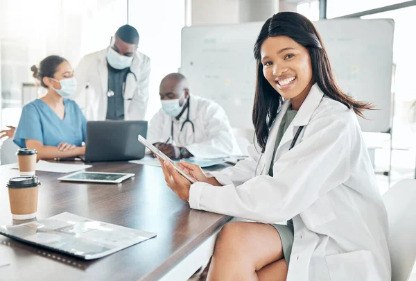 Healthcare, diversity and black woman doctor with tablet at meeting with team of doctors. Success, communication and collaboration, proud female medical worker and leader in the field of medicine