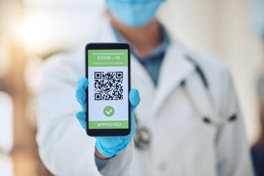 Doctor covid travel, vaccine passport on smartphone and vaccination certificate. International immigration, digital health innovation app, qr code technology and airport security regulation check.