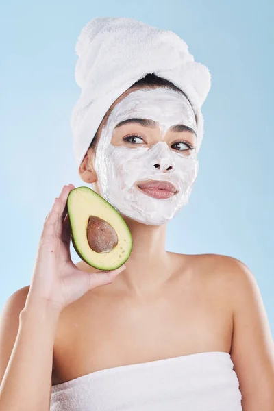 Avocado, skincare and woman with facial face mask for cleaning, detox and healthy pores in a beauty portrait. Wellness, peeling and dermatology cosmetics lotion for natural cream product treatment.