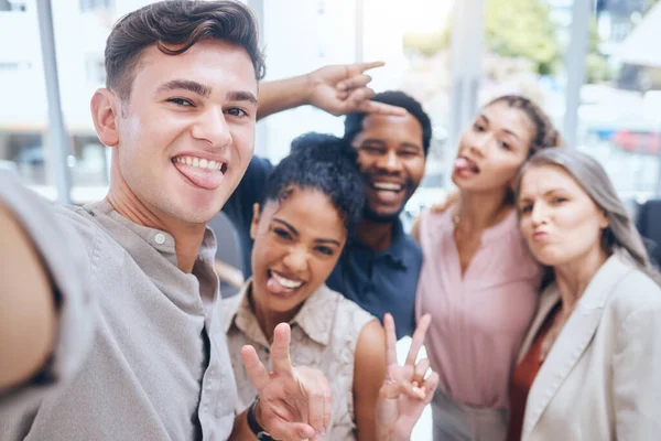 Selfie, peace and teamwork with a team of business people working in collaboration and taking a picture together. Motivation, fun and solidarity with a group of work friends posing in the office.