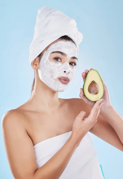 Skincare, beauty and avocado face mask with a beautiful woman taking care of her clean and healthy skin. Organic, fresh and cleansing facial with routine homemade treatment and natural ingredients.