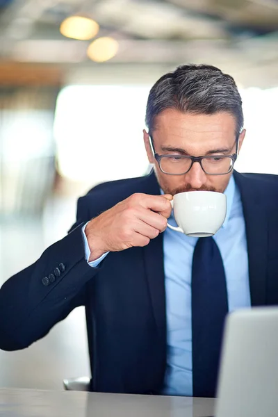 Staying Top His Emails Businessman Drinking Coffee Using Laptop Office — Stok fotoğraf