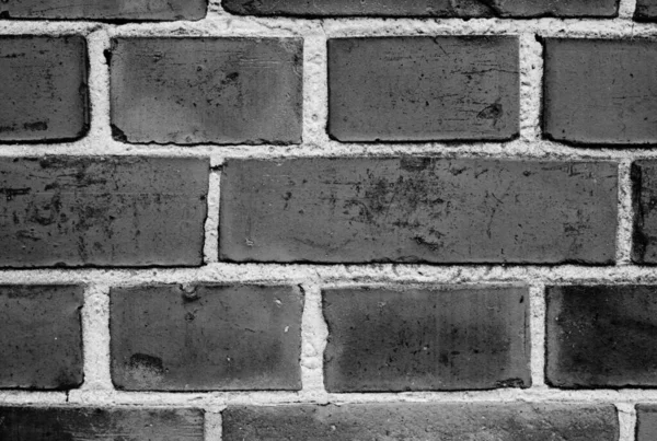 Keeping things in, and keeping things out. a facebrick wall