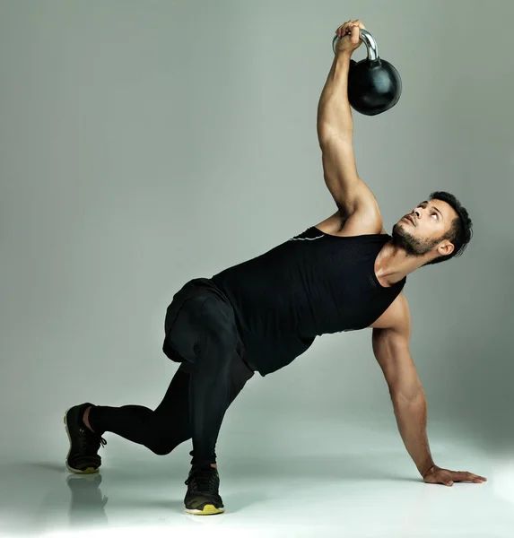 Killer Workout Studio Shot Young Man Working Out Kettle Bell — Stockfoto