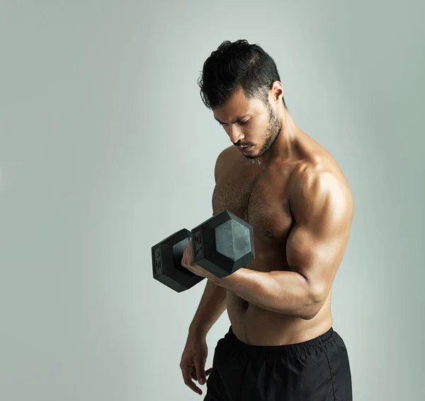 Perfecting His Form Studio Shot Young Man Working Out Dumbbell — Stok fotoğraf