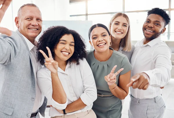 Team building, selfie and happy business people at work enjoy bonding and taking a picture together to post it. Diversity, smile and excited friends having fun in the office after a marketing meeting.