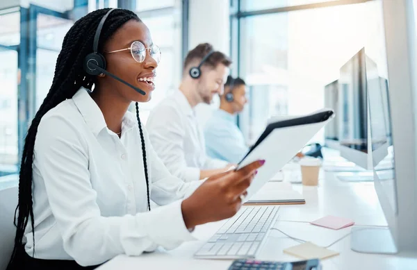 Contact us, customer support and happy call center consultant working in office, smiling while helping clients. Young professional female enjoying provide good online or virtual service and advice.