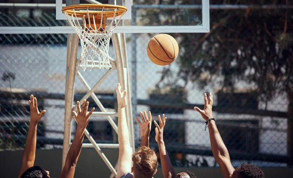 Basketball, sports and fitness with friends on a court for sport, health and exercise outside during summer. Training, workout and recreation with a team of players playing a game or match outdoors.