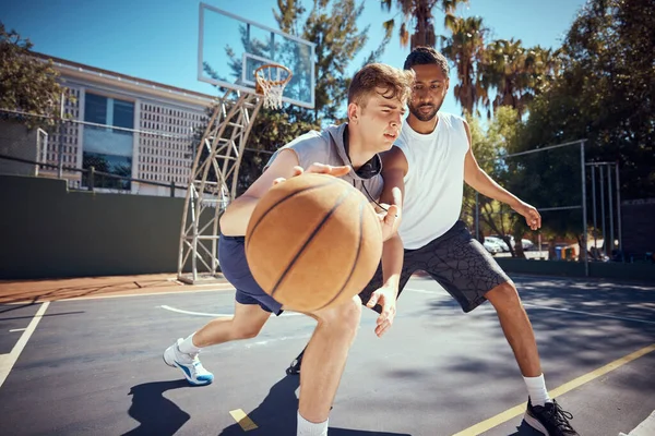 Basketball, sport and fitness with friends on a sports court outside with an opponent for a game or match. Exercise, training and workout with with a male athlete and his competition for health.