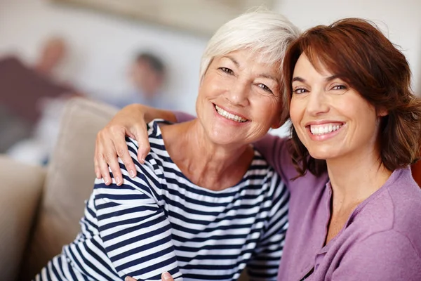 They treasure each other. Portrait of a mother and daughter at home