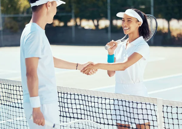 Tennis shaking hands before playing court game smiling athletes team standing and handshake for good luck. Man and woman play competitive sports match for health fitness on a court at a sport club.
