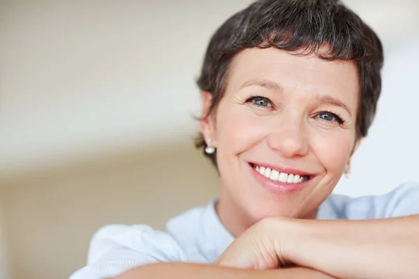 Business woman with confident smile. Closeup portrait of happy mature business woman with confident smile