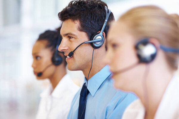 Call center operators. Portrait of male and female operators with headset at call center