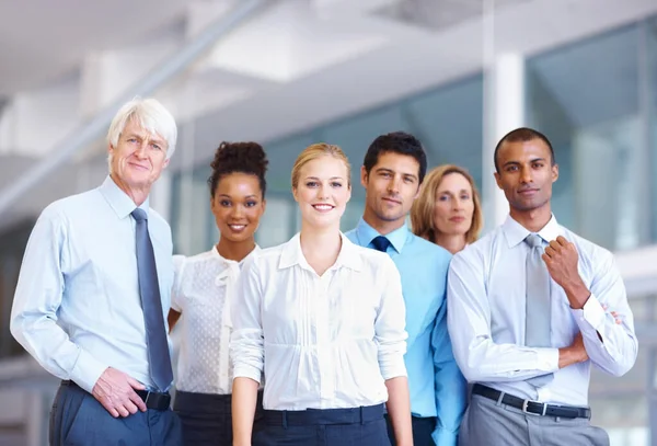 Confident business people. Portrait of confident multi racial business people together at office