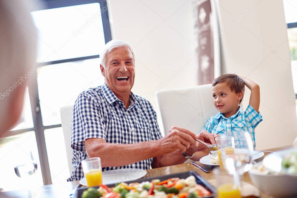 Lunch with a serving of laughter. a family enjoying a meal together