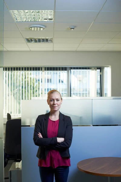 She runs this office with confidence. Portrait of an attractive businesswoman standing with her arms crossed in the office