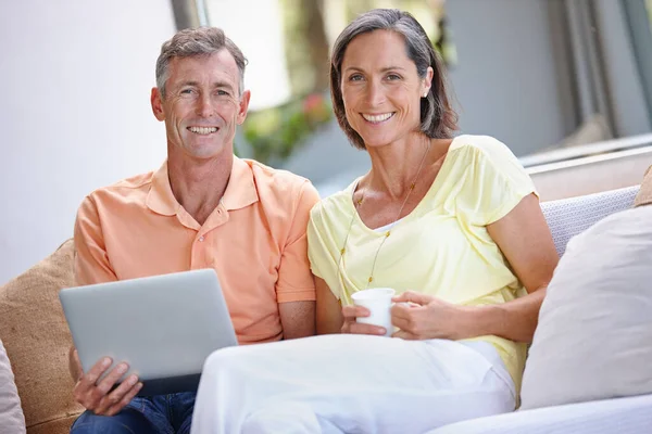 Theyre Connected Couple Portrait Loving Mature Couple Relaxing Digital Tablet Stock Picture