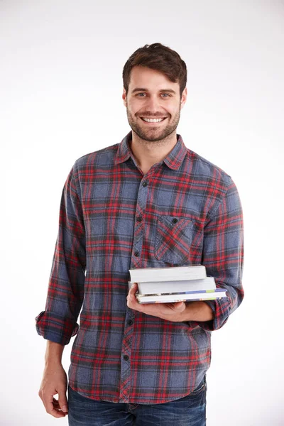 Feeling Positive Education Studio Portrait Smiling Young Man Holding Pile Stock Image