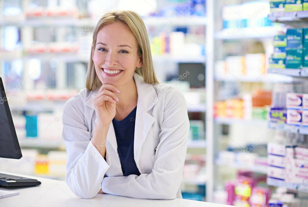 Helping my customers get better is the best feeling. Portrait of an attractive pharmacist standing at the prescription counter