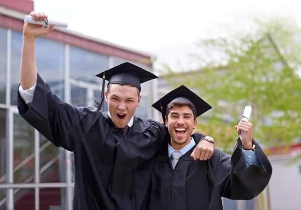 Moving on. two guy friends celebrating on their graduation day