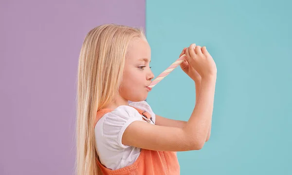 Mmm Its Chewy Cute Little Girl Eating Candy Colorful Background — Stock Photo, Image