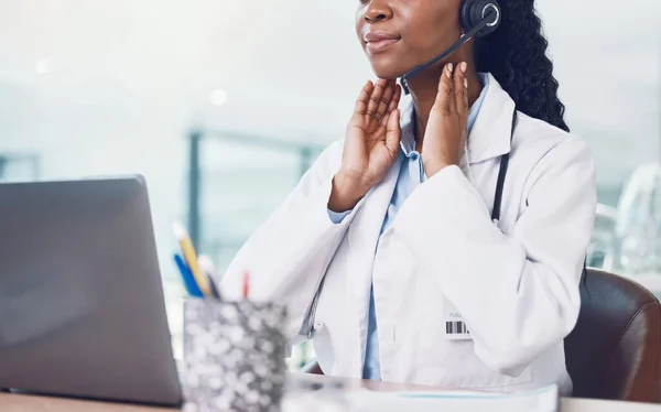Telehealth, video call and thyroid doctor on virtual consultation online for thyroid exam, medical advice or assessment. Innovation healthcare, black woman with laptop for digital consulting service.