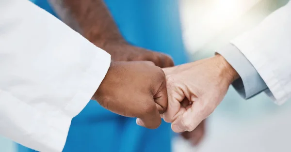 Fist bump hands, healthcare teamwork and group support for medical goals, collaboration and mission. Closeup doctor group motivation, partnership and success celebration for medicine solidarity trust.