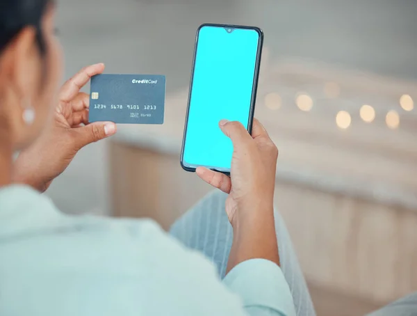 Ecommerce, credit card and woman with green screen phone mockup in hand for a payment, online shopping and banking. Female using fintech app and paying on internet with website app on 5g smartphone.