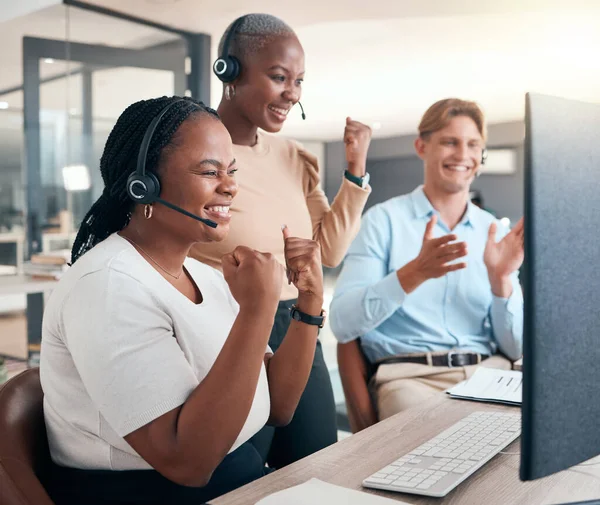 Call center, celebrate and cheer for success, target or online good review on computer with teamwork, motivation and diversity. Black women and man in customer support, telemarketing and CRM team.