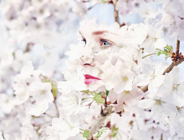 Inner blossoming. Composite image of flower blossoms superimposed on a woman