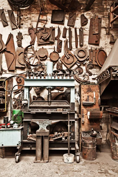 An artists tools. a metal craftsmans workshop filled with tools
