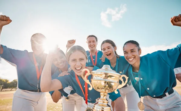 Girls, baseball team and success trophy with winner, wow and game celebration on fitness stadium field. Smile, happy or excited sports women in collaboration exercise, teamwork training and workout.