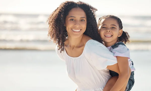 Mom, girl kid and family portrait at beach holiday, summer vacation and relaxing seaside together. Excited, smile and happy mom, young piggyback child and play, love and happiness sunshine at ocean.