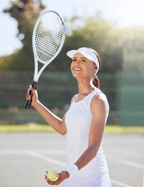 Woman, serving and sports game on tennis court for exercise, workout and training in summer. Smile, happy and fitness player with health motivation, wellness goals or energy in racket and ball match.