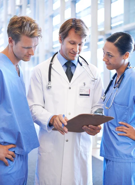 Making Informed Decision Medical Team Standing Hospital Corridor —  Fotos de Stock