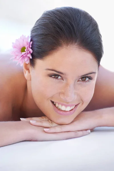 Her day at the beauty spa. An attractive young woman lying down during relaxing spa day
