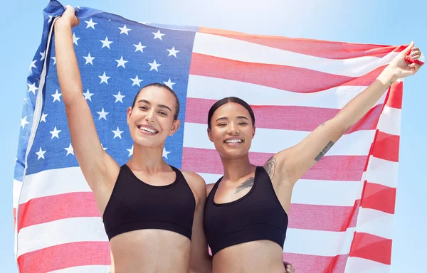 USA winner flag, women in sports and runner on podium at marathon event, team celebration at professional game and smile for success. Portrait of running athlete with support at group competition.