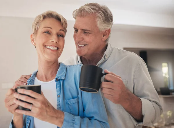 Coffee, love and old couple smile in home drinking beverage, caffeine or cappuccino. Relax, retirement and tea with elderly, happy married man and woman together care, affection and support in house