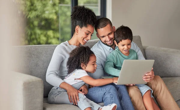 Laptop elearning and family on sofa or parents help with children education, support or watch cartoon show together. Relax mother, father and kids on couch on fun digital pc games or streaming online.