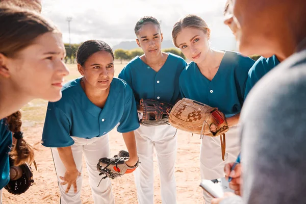 Baseball, team and coach in conversation, talking and speaking about game strategy for a game. Teamwork, collaboration and coaching with women or teens listen to group leader during sport discussion.