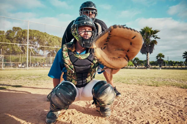 Baseball, sport and team person fielder on a outdoor sports field during a exercise game or match. Fitness, training and cardio workout of a athlete man with focus ready to catch a fast ball.