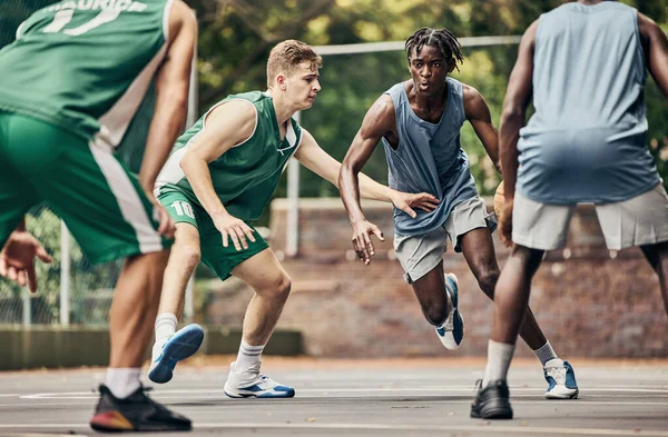 Energy fitness and basketball at basketball court with team playing in competitive sports game. Exercise training and sport challenge by group of players running competing intense cardio workout. Stoc...