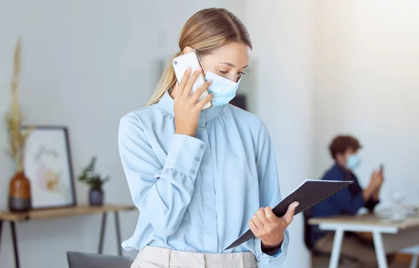 Woman, covid face mask or business phone call in marketing office, advertising startup or creative company. Worker or virus compliance employee with paper research documents for mobile b2b sales deal.