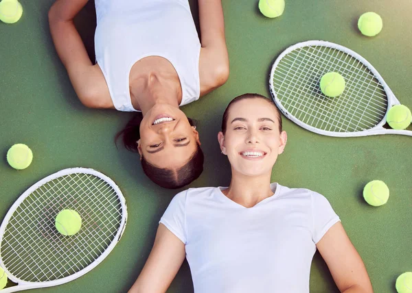 Tennis, women and relax portrait from above on sports court with friends resting together on floor. Women athlete team with happy, young and cheerful people on fitness break at tournament training