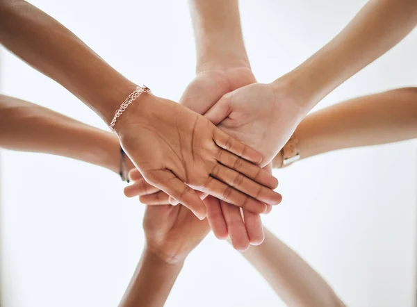 Group of hands in unity, teamwork motivation or support for partnership goal, success and collaboration achievement. Team building, community or friends with trust for vision, mission or deal.