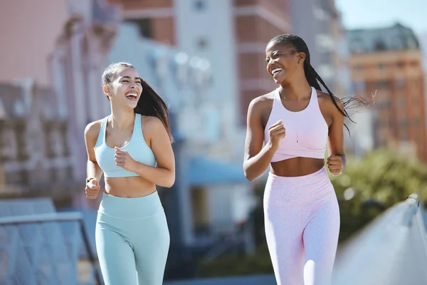 Fitness, women and city friends running in street on summer morning in Brazil. Health, urban exercise and girl time to workout and laugh, black woman and best friend or personal trainer run together